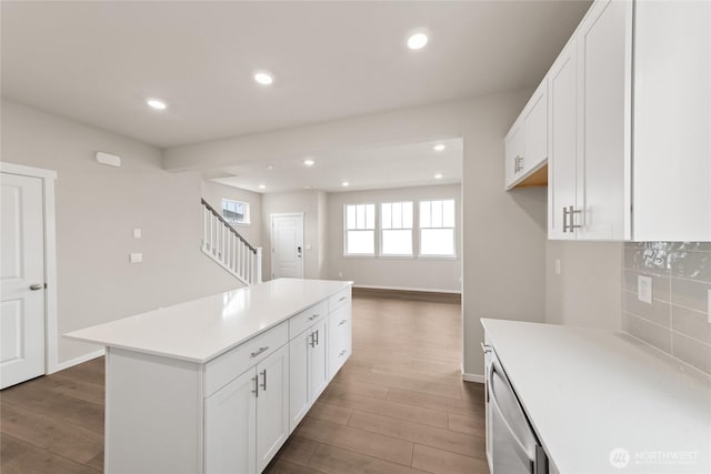 kitchen featuring recessed lighting, wood finished floors, and white cabinets