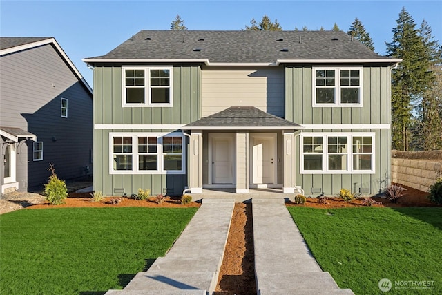 traditional-style home featuring board and batten siding and a front lawn
