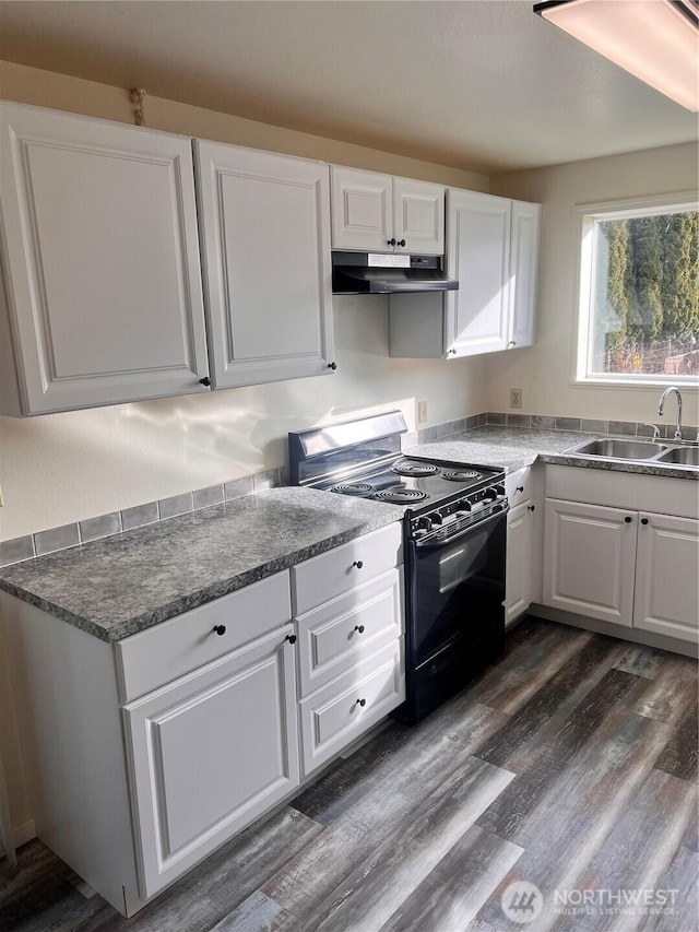 kitchen featuring black / electric stove, a sink, under cabinet range hood, white cabinets, and dark wood-style floors