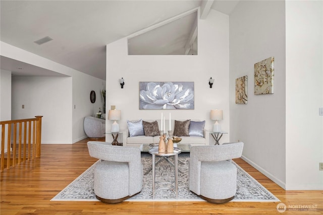 4538 Somerset Dr SE, Bellevue, WA 98006 - living room featuring beam ceiling, wood finished floors, high vaulted ceiling, visible vents, and baseboards