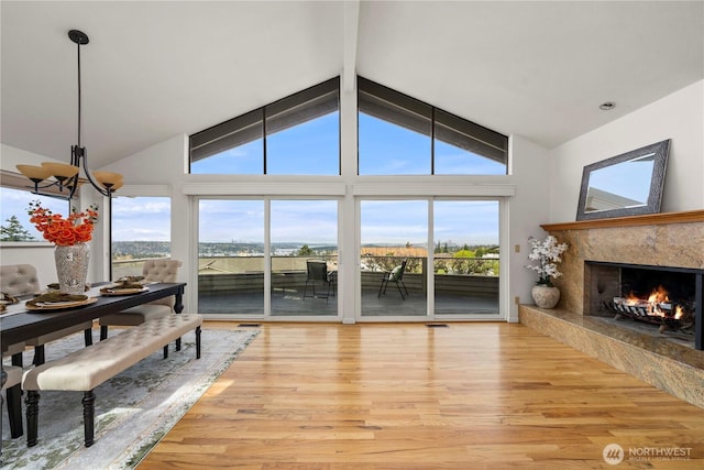 4538 Somerset Dr SE, Bellevue, WA 98006 - living area with plenty of natural light, light wood-style flooring, a fireplace, and beamed ceiling
