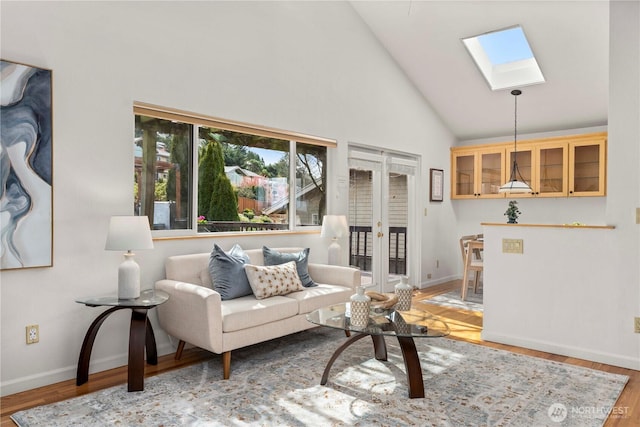 4538 Somerset Dr SE, Bellevue, WA 98006 - living area featuring wood finished floors, baseboards, a skylight, and high vaulted ceiling