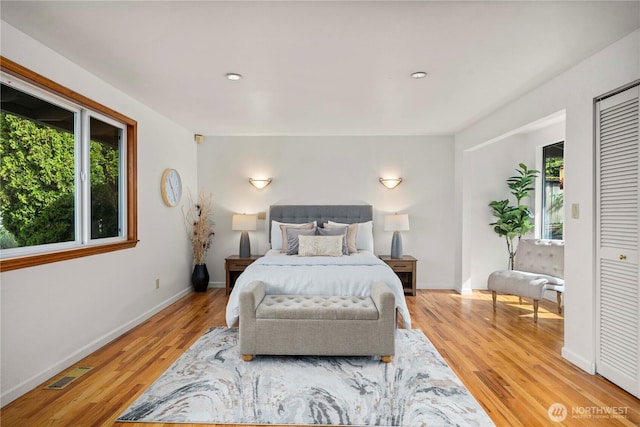 4538 Somerset Dr SE, Bellevue, WA 98006 - bedroom featuring multiple windows, visible vents, wood finished floors, and baseboards