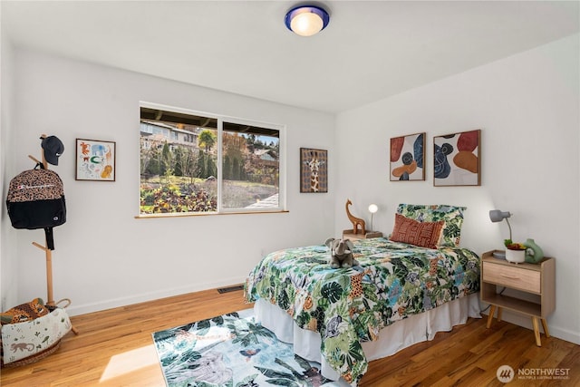 4538 Somerset Dr SE, Bellevue, WA 98006 - bedroom featuring baseboards, visible vents, and wood finished floors