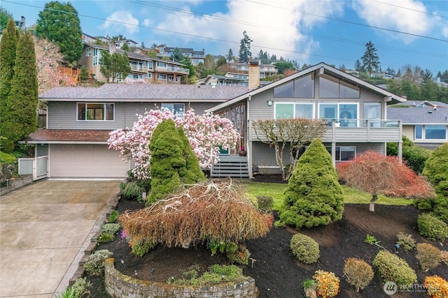 4538 Somerset Dr SE, Bellevue, WA 98006 - raised ranch featuring a deck, a garage, and driveway
