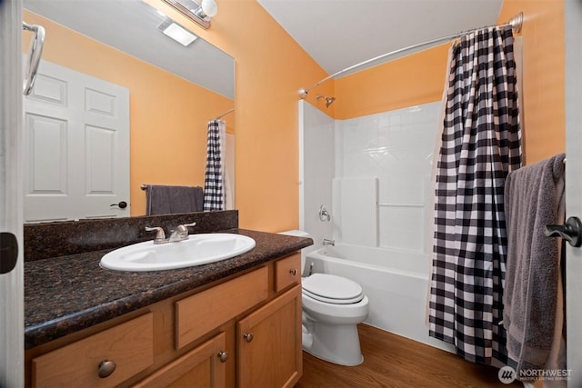 full bathroom with wood finished floors, vanity, toilet, and shower / bathtub combination with curtain