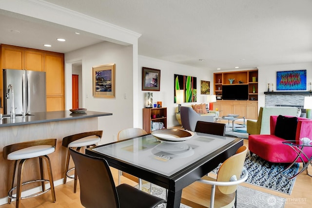 dining space featuring light wood-style floors and recessed lighting