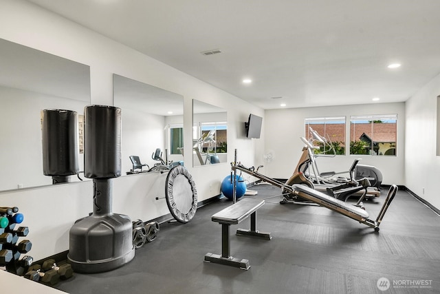 workout room featuring baseboards, visible vents, and recessed lighting