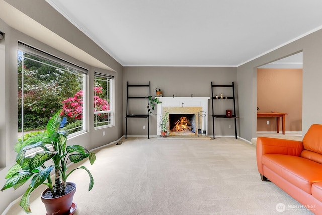 19801 88th Ave W, Edmonds, WA 98026 - living area featuring healthy amount of natural light, ornamental molding, light colored carpet, a high end fireplace, and baseboards