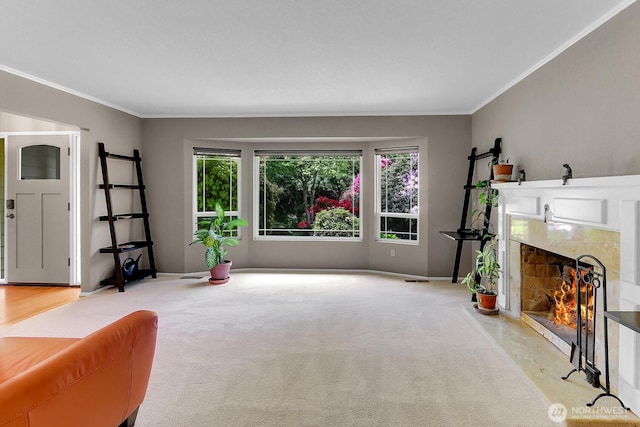 19801 88th Ave W, Edmonds, WA 98026 - unfurnished living room featuring crown molding, a premium fireplace, light colored carpet, and baseboards