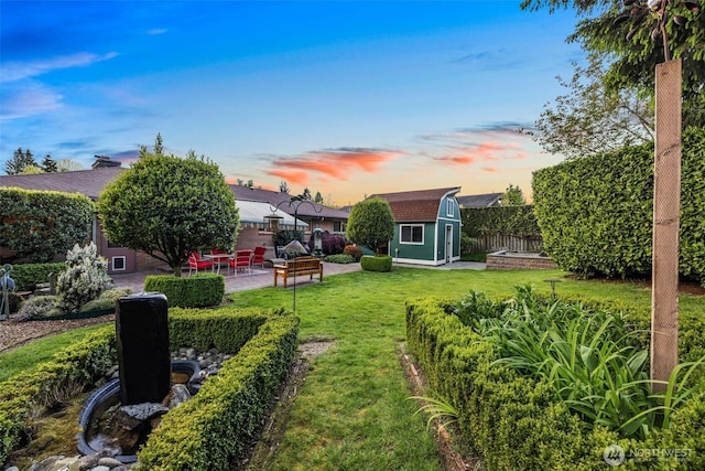 17922 Marine View Dr SW, Normandy Park, WA 98166 - view of yard with a fenced backyard, an outdoor structure, a patio, and a shed