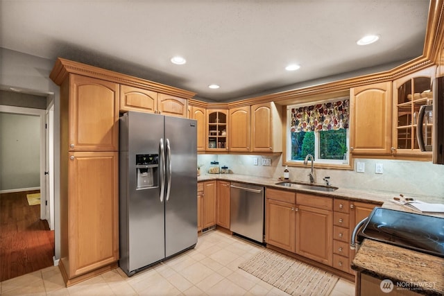 17922 Marine View Dr SW, Normandy Park, WA 98166 - kitchen with glass insert cabinets, a sink, stainless steel appliances, light stone countertops, and recessed lighting