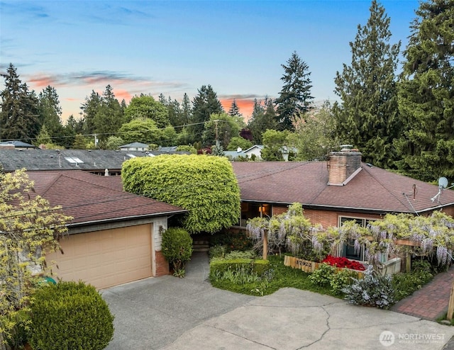 17922 Marine View Dr SW, Normandy Park, WA 98166 - single story home with a chimney, brick siding, a garage, a shingled roof, and concrete driveway
