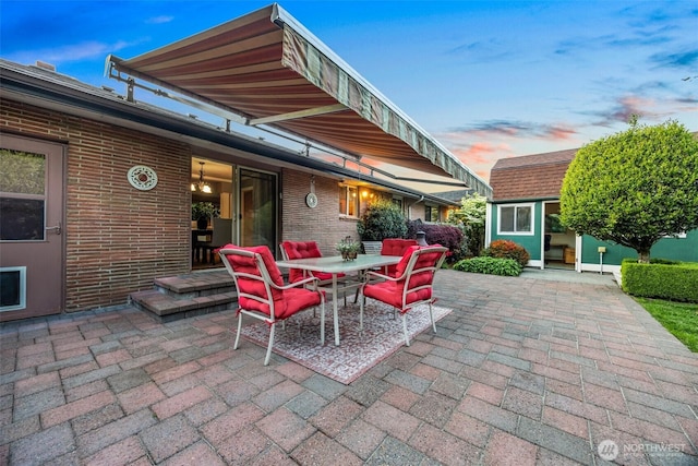 17922 Marine View Dr SW, Normandy Park, WA 98166 - patio terrace at dusk with outdoor dining space