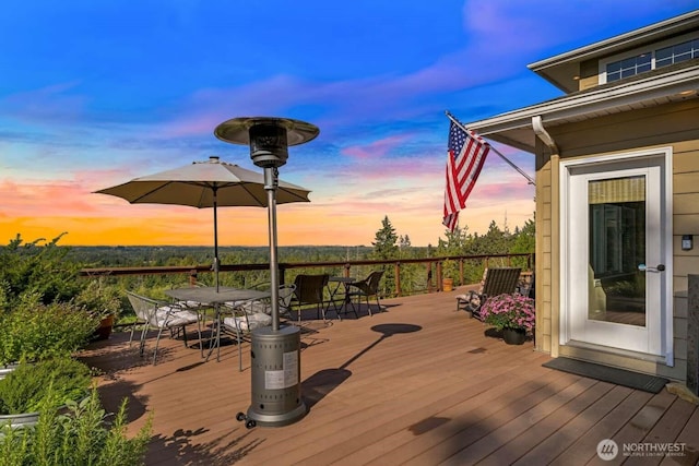 wooden deck featuring outdoor dining space