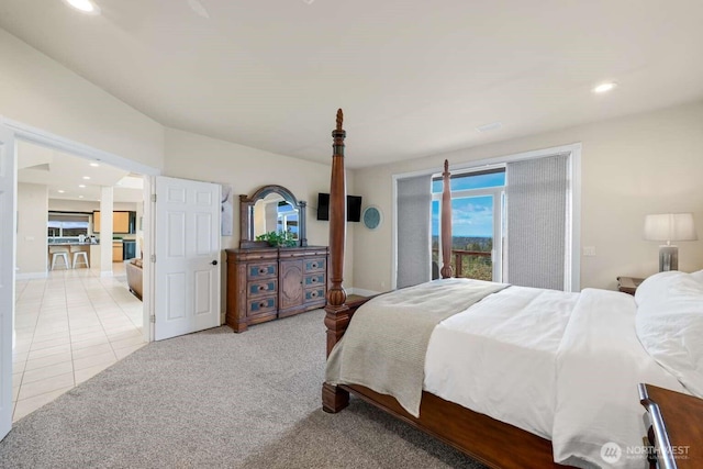 bedroom with light colored carpet, access to outside, light tile patterned flooring, and recessed lighting