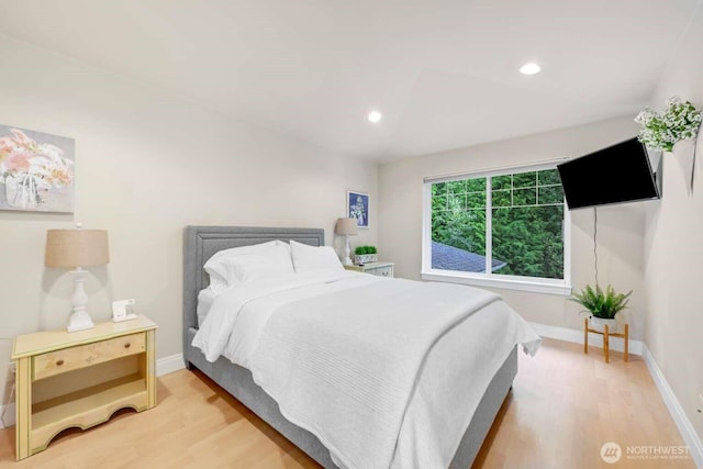 bedroom featuring recessed lighting, baseboards, and light wood-style floors
