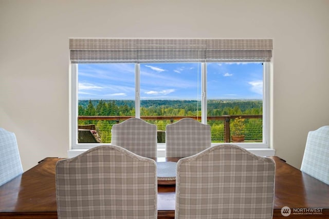 dining room with a healthy amount of sunlight and wood finished floors