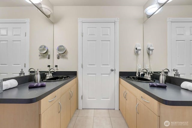 bathroom with tile patterned floors and vanity