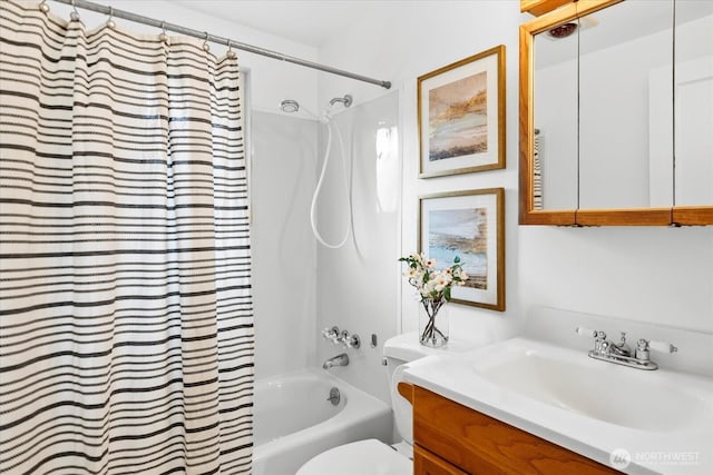 bathroom featuring shower / tub combo with curtain, vanity, and toilet
