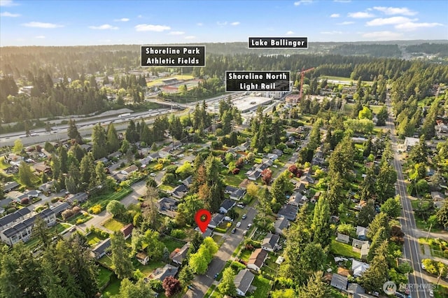 aerial view of property's location with a forest
