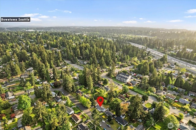 view of property location featuring a heavily wooded area