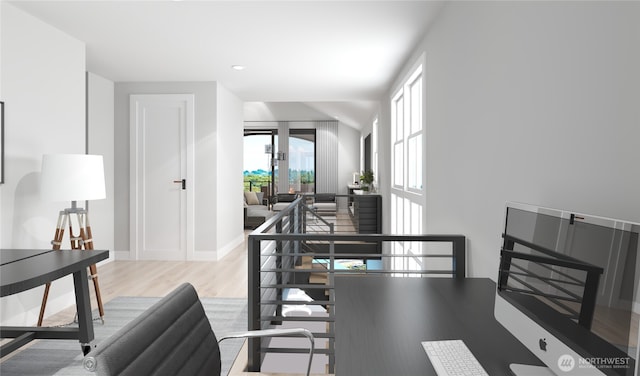 interior space featuring baseboards and wood finished floors