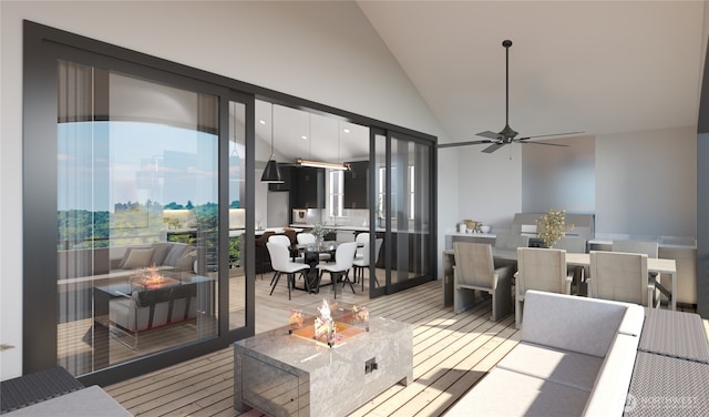 living room with a ceiling fan, light wood finished floors, high vaulted ceiling, and plenty of natural light