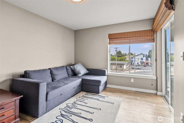 8075 Harborview Rd Unit 301, Blaine, WA 98230 - living room featuring wood finished floors and baseboards