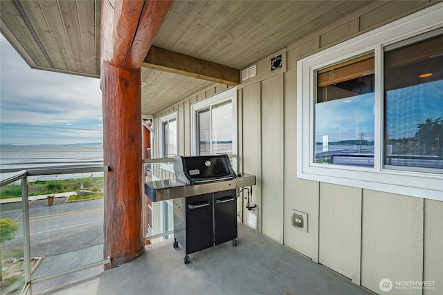 8075 Harborview Rd Unit 301, Blaine, WA 98230 - view of patio with a water view and a grill