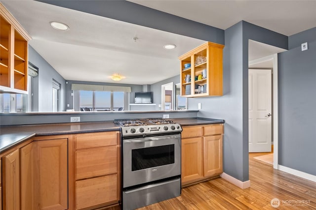 8075 Harborview Rd Unit 301, Blaine, WA 98230 - kitchen with stainless steel gas range, open shelves, dark countertops, light wood-style flooring, and recessed lighting