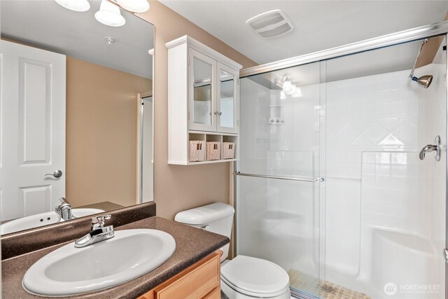 8075 Harborview Rd Unit 301, Blaine, WA 98230 - full bathroom with a shower stall, toilet, and vanity