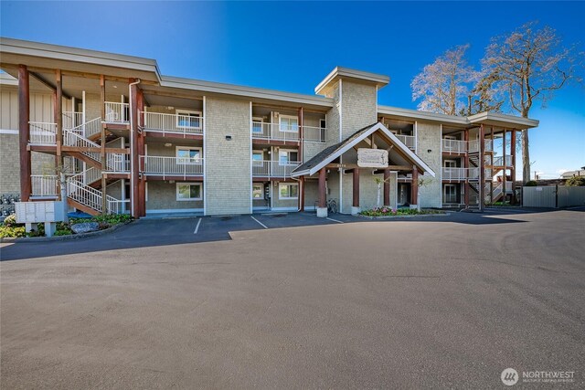 8075 Harborview Rd Unit 301, Blaine, WA 98230 - view of apartment building / complex with uncovered parking