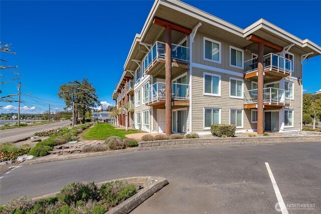 8075 Harborview Rd Unit 301, Blaine, WA 98230 - view of apartment building / complex with uncovered parking