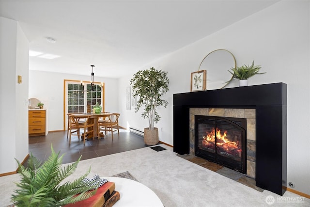 3785 Greenville Pl, Bellingham, WA 98226 - living room featuring a baseboard radiator, a tiled fireplace, and baseboards
