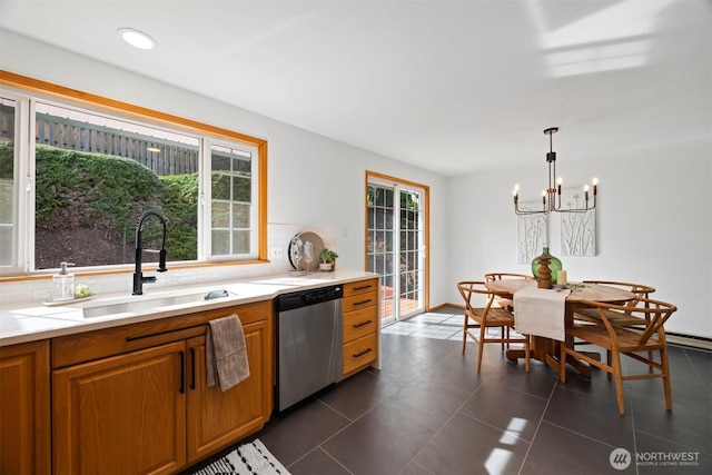 3785 Greenville Pl, Bellingham, WA 98226 - kitchen with dishwasher, a sink, a chandelier, light countertops, and brown cabinetry
