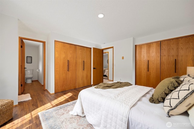 3785 Greenville Pl, Bellingham, WA 98226 - bedroom featuring multiple closets and wood finished floors
