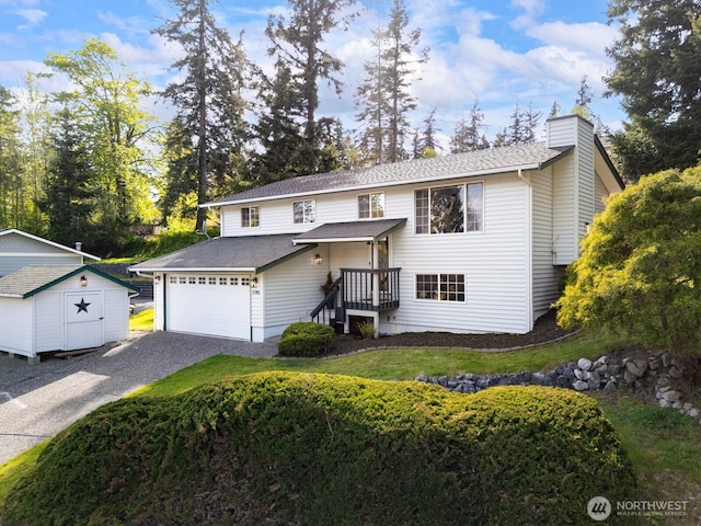 3785 Greenville Pl, Bellingham, WA 98226 - traditional home with a storage shed, a chimney, an outbuilding, gravel driveway, and roof with shingles