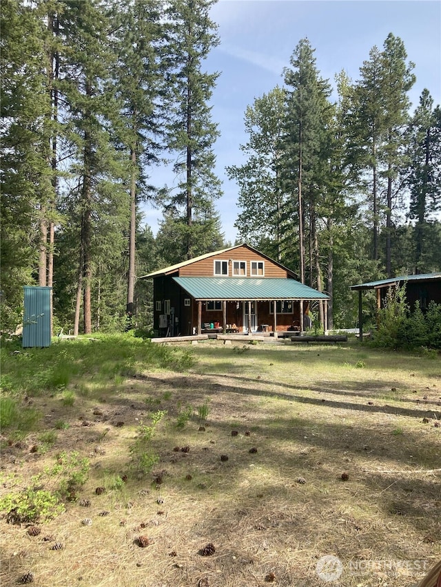 view of front of home with metal roof and covered porch