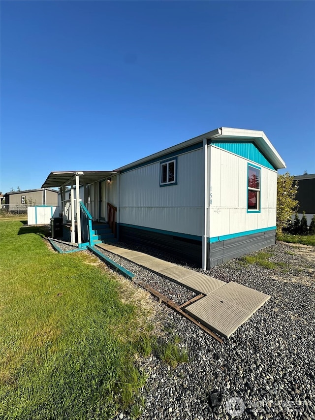 back of property with a lawn