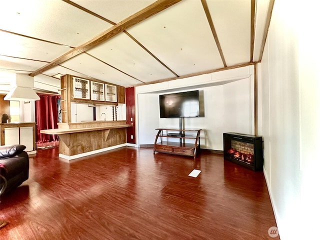 living room with wood finished floors and baseboards