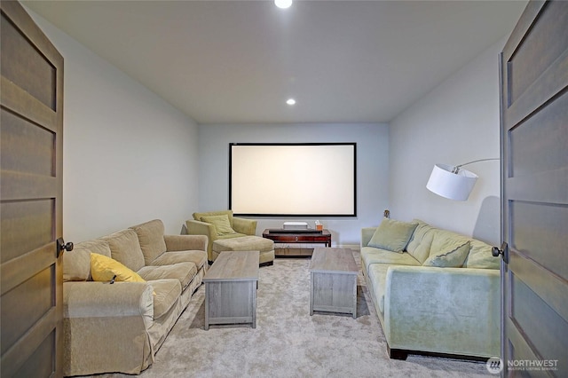 home theater room with recessed lighting and light colored carpet