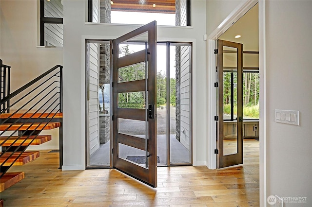 1699 SE Camano Dr, Camano Island, WA 98282 - foyer with wood-type flooring, stairway, and french doors