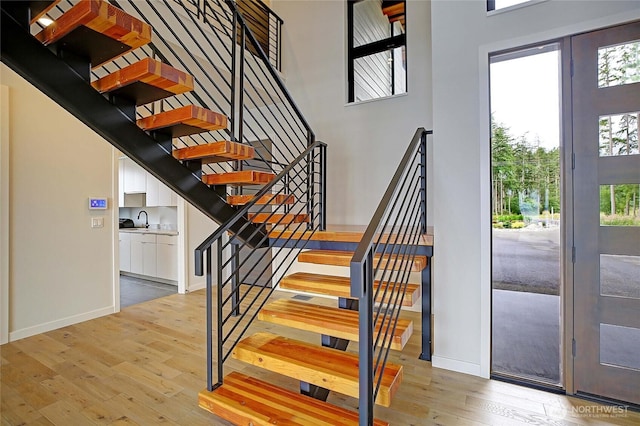 1699 SE Camano Dr, Camano Island, WA 98282 - stairs with hardwood / wood-style floors and baseboards