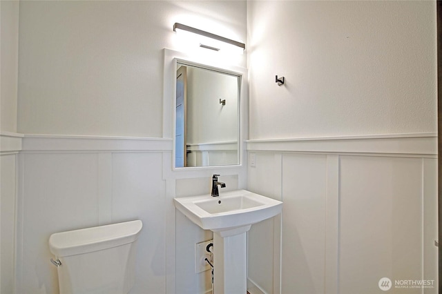 1699 SE Camano Dr, Camano Island, WA 98282 - bathroom with a decorative wall and wainscoting