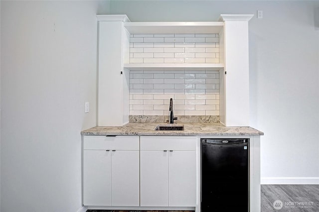 1699 SE Camano Dr, Camano Island, WA 98282 - indoor wet bar with tasteful backsplash, wood finished floors, and fridge