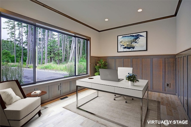 1699 SE Camano Dr, Camano Island, WA 98282 - home office with plenty of natural light, light wood-style flooring, crown molding, wainscoting, and a decorative wall