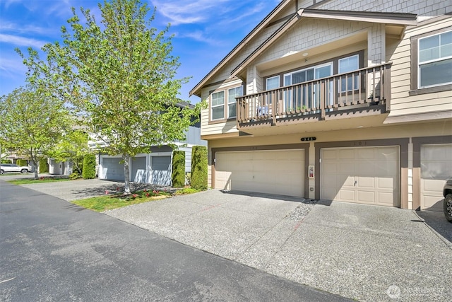 343 Tremont Ave Unit 102, Bellingham, WA 98226 - townhome / multi-family property featuring a balcony, driveway, and a garage