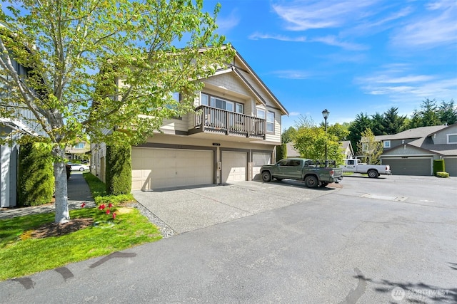 343 Tremont Ave Unit 102, Bellingham, WA 98226 - view of front of house with an attached garage, driveway, and a balcony