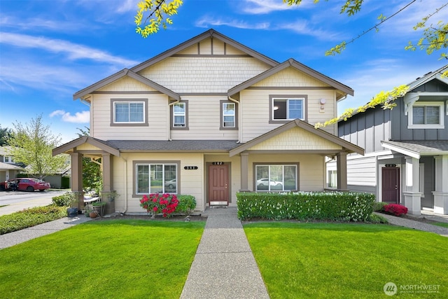343 Tremont Ave Unit 102, Bellingham, WA 98226 - view of front facade featuring a shingled roof and a front yard